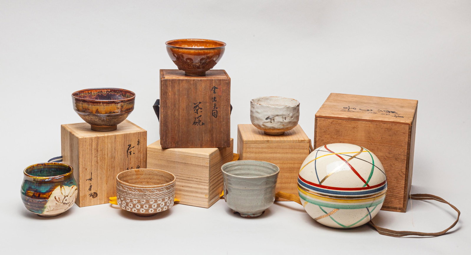 Antique/Vintage Japanese Stoneware Porcelains: Including a Japanese stoneware porcelain covered box and tea bowls. Approx. 6-6.75 inch (largest).