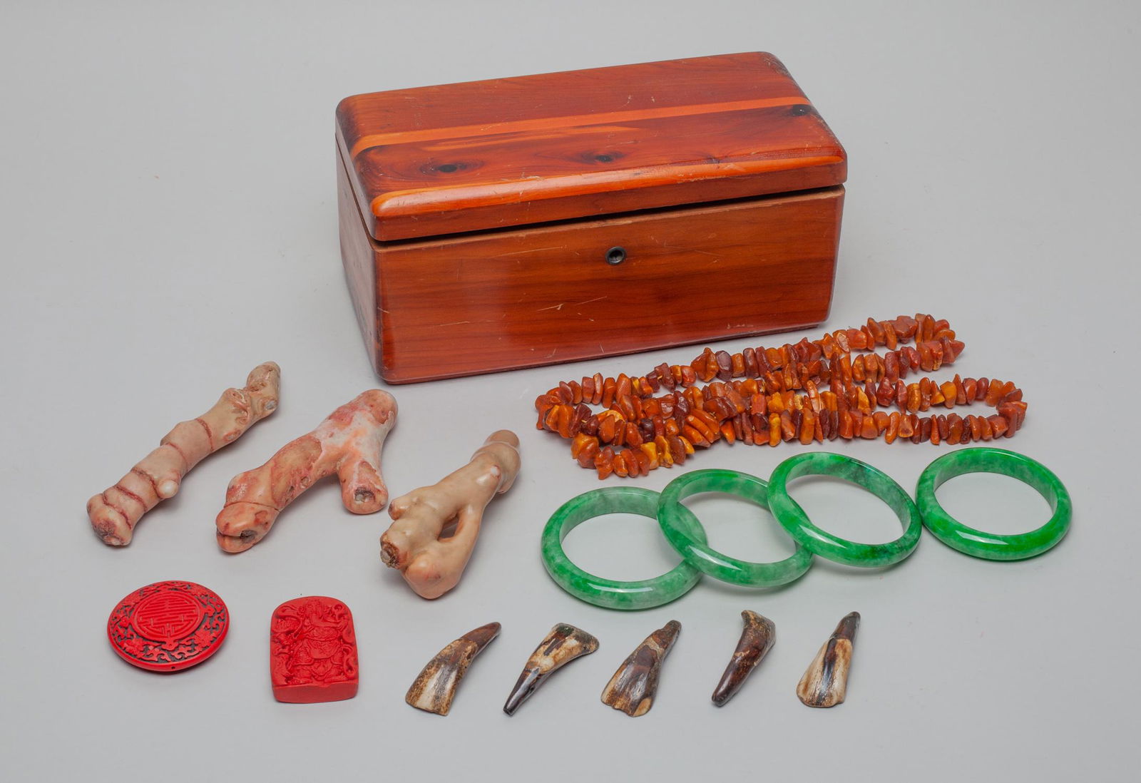 Nature Amber, Chinese Bangle & Jewelry: Including green-color bangles, coral like carvings, tooth form pendants, red-color carvings and an amber like necklace, with box. 35inch L (necklace size).
