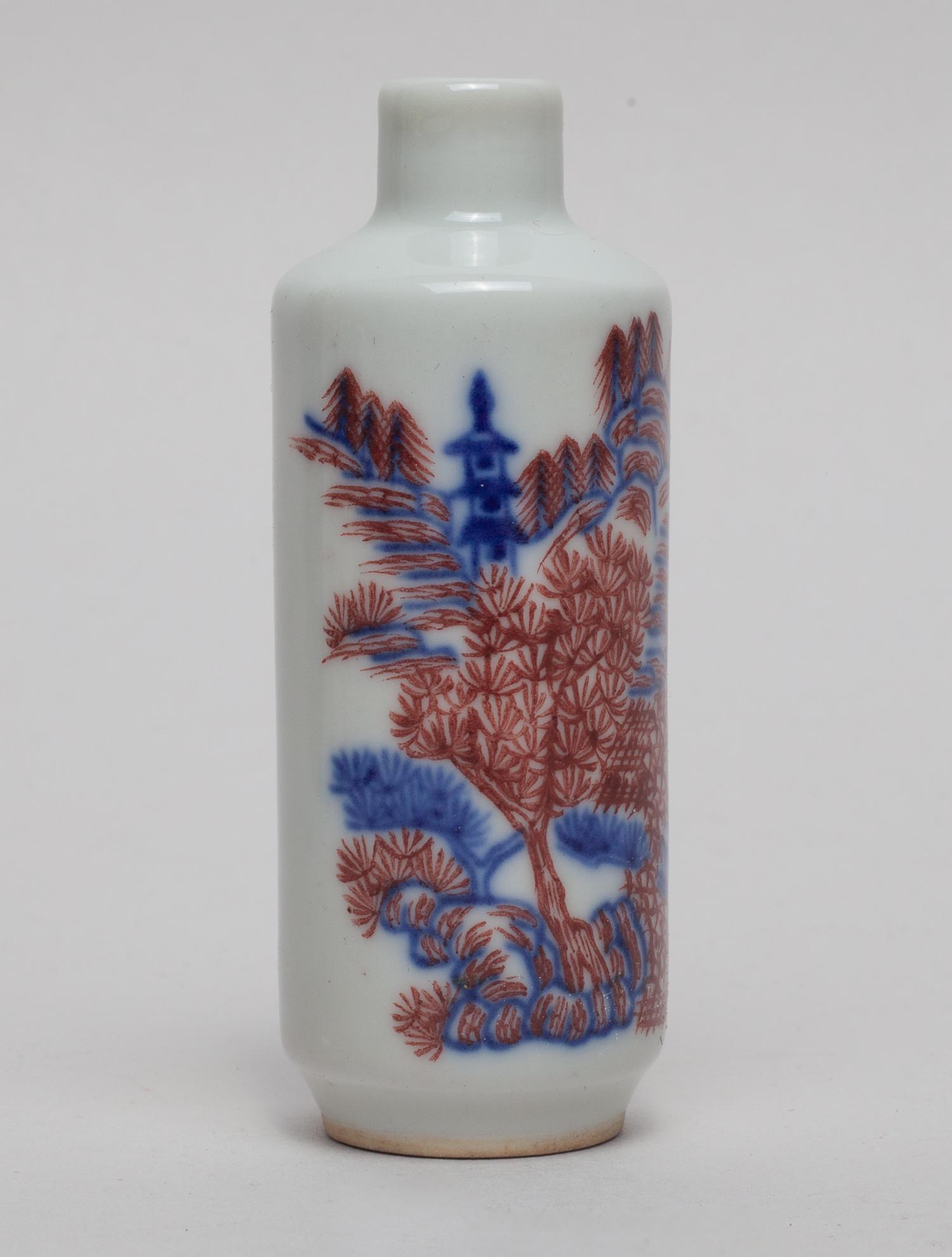 Chinese Blue White & Red Snuff Bottle: Of cylindrical form, the body painted in blue and brown-red with mountain landscape. 3.3inch H, 1.2inch W.