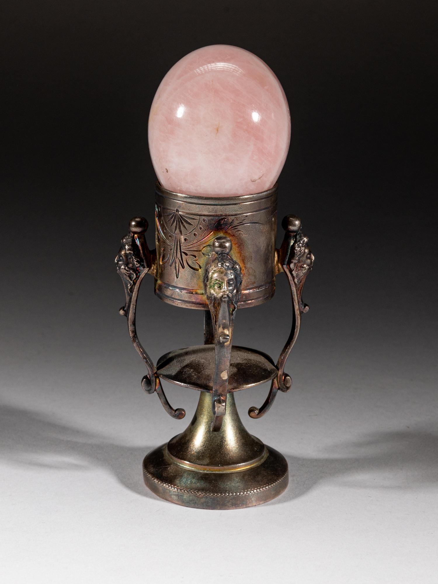 Silver-plated Table Ware w/ Quartz Egg: Rose quartz carved egg sculpture supported on special silver-plated stand, the bottom marked Triple Plate. Approx. 2.5-2 inch (egg size).
