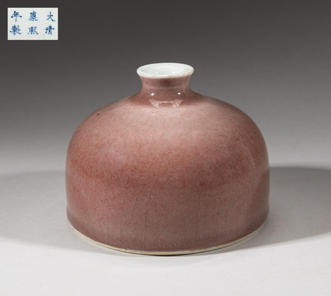 Chinese Porcelain Water Pot: Of compressed form with short waisted neck, the exterior covered in grayish soft red glaze, the bottom marked six characters. Approx. 5.1-3.8 inch.