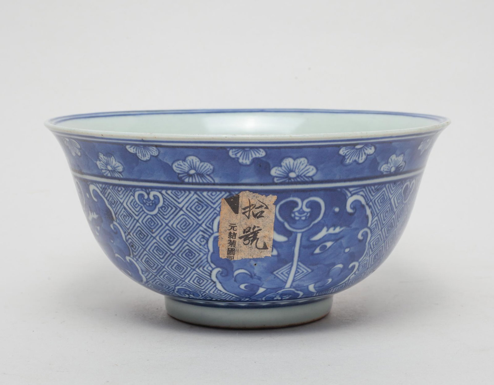 Large Chinese Blue & White Porcelain Bowl: The bowl exterior painted with beast masks on fret ground, the interior centre with lotus and ruyi heads. Approx. 7.2-3.5 inch.