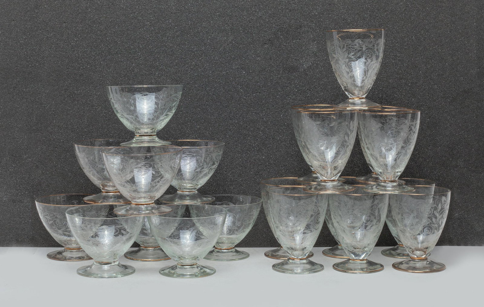 Italian Cut Glass Wine Cups: A large group of Italian type glass cut wine cups, carved with leafy scrolls. Approx. 3.7-2.8 inch (laregst).