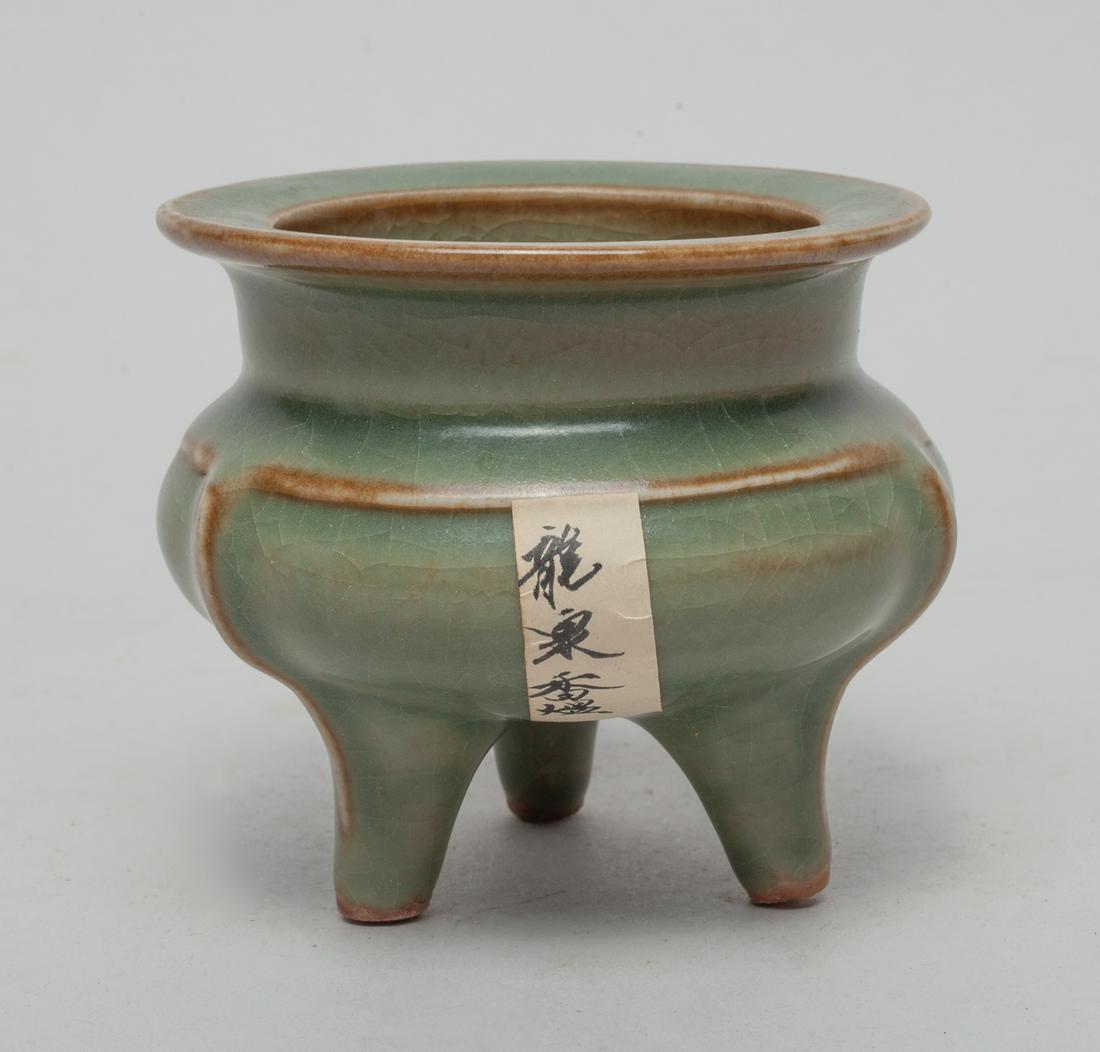 Chinese Longquan Porcelain Censer: The compressed body rising from three legs to a broad neck and flat rim, covered overall in celadon glaze suffused with crackles. Approx. 3.1-3.6 inch.