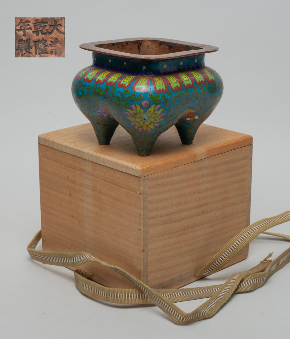 Chinese Cloisonne Censer: Of square section with four tapered legs, the exterior enameled with lotus sprays on turquoise ground, the bottom marked with six characters, with box. Approx. 4.4-4.4-3.3 inch (censer size).