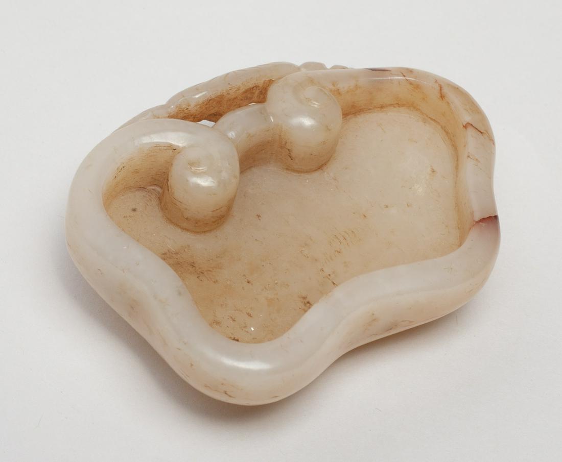 Chinese Jade Carved Washer: Of ruyi head shape issuing from a gnarled stem with more ruyi heads and leaves. Approx. 2.8-2.1 inch.