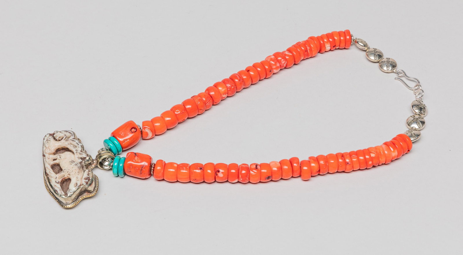 Rare Zuni Necklace: Zuni bead necklace with a bone pendant carved with a deer and a tree. Approx. 18inch L.