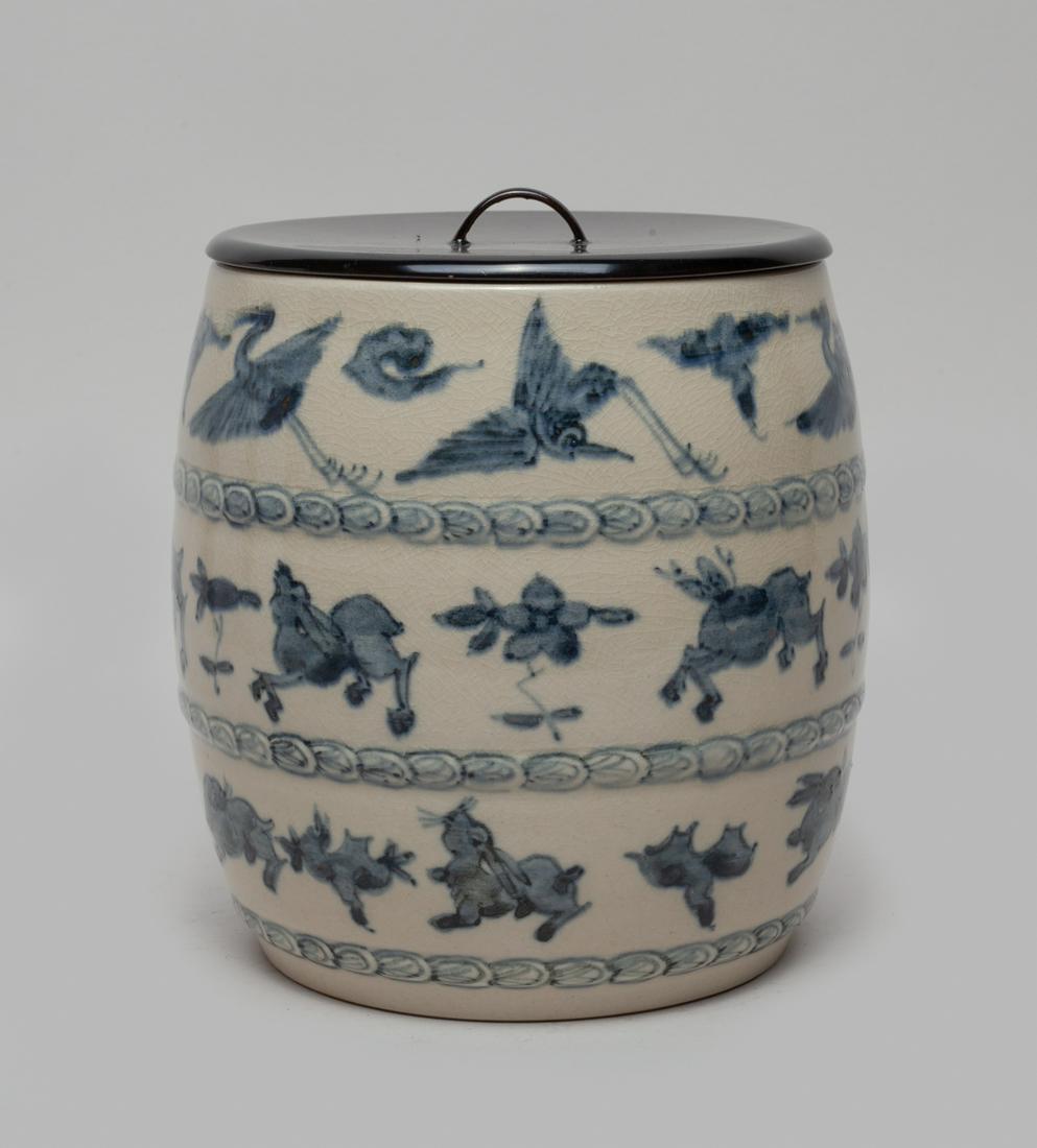 Korean Blue & White Porcelain Taoiem Jar: The drum-shaped body painted with cranes, deer and rabbits on a crackled white ground, with lid. Approx. 6.2-6 inch.