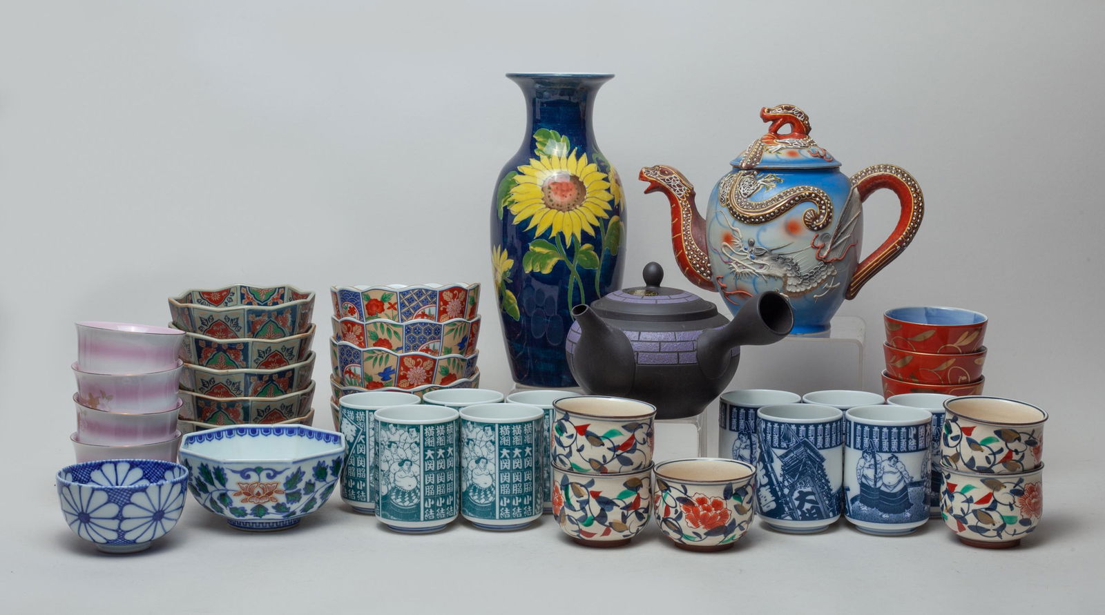 Estate Japanese Porcelain Set: Including a vase, two pots and a large group of bowls and tea cups. Approx. 10-4.2 inch (vase size).