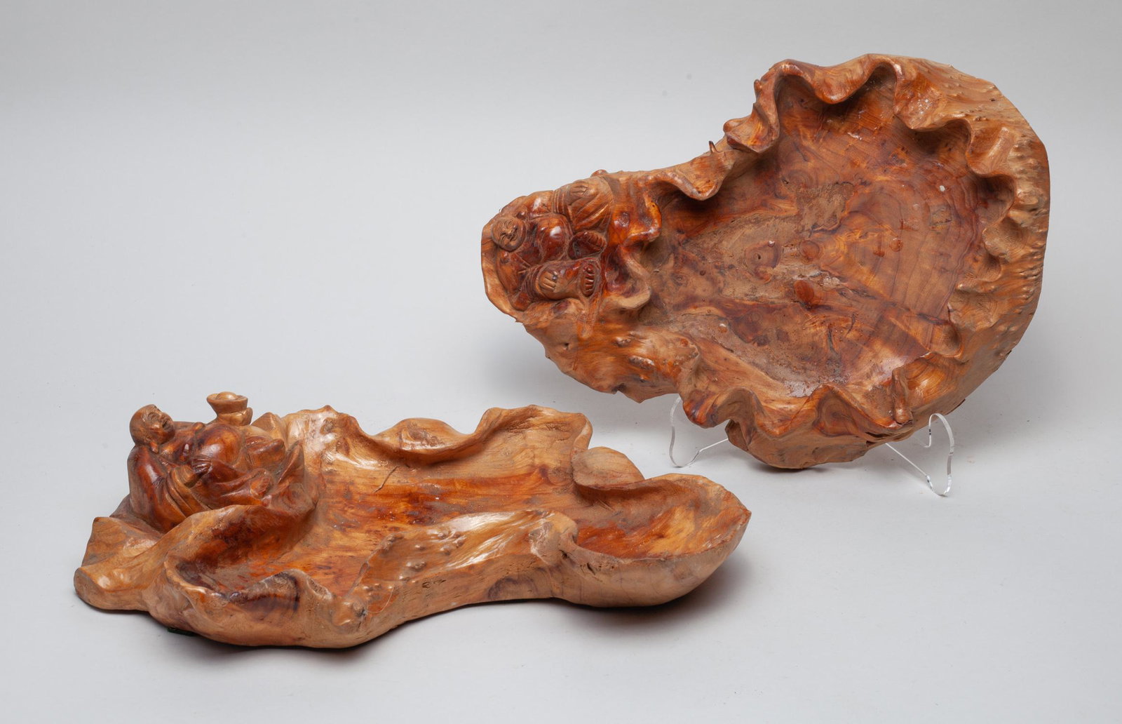 Two Asian Carved Wood Trays: Two special form wood carved trays, each carved with Buddha on the rim. Approx. 14.5-9.2-3 inch (larger).