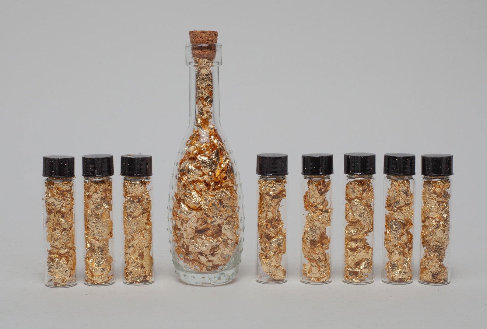 Vials of 23/24 K Gold Leaf: Set of 9 vials of 23K or 24K gold leaf. Size varies.