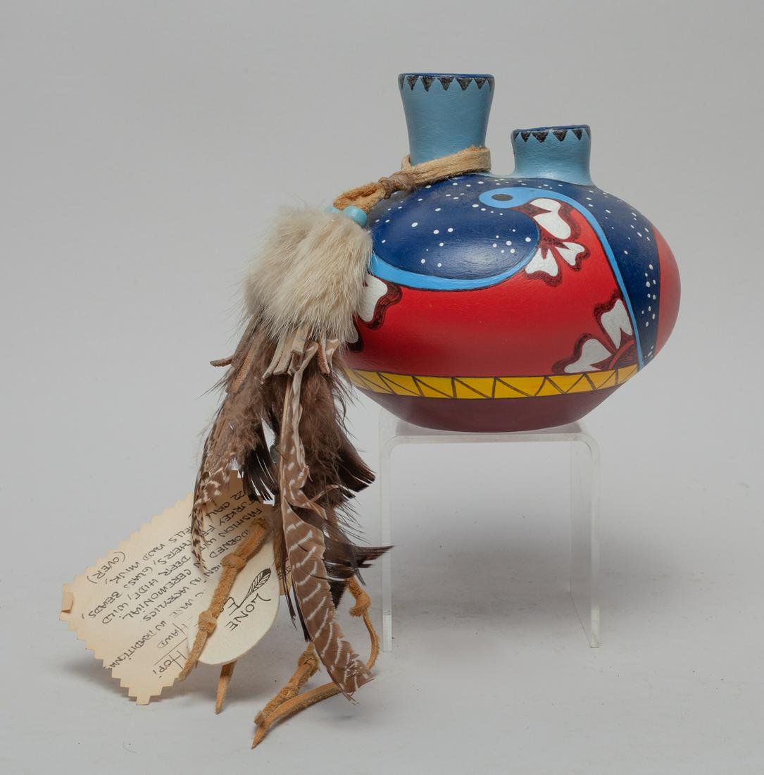 Lone Eagle Hopi Clay Vase: Hopi clay vase with two necks, painted with abstract pattern, decorated with feather, marked LONE EAGLE. Approx. 4.8-5.4 inch.
