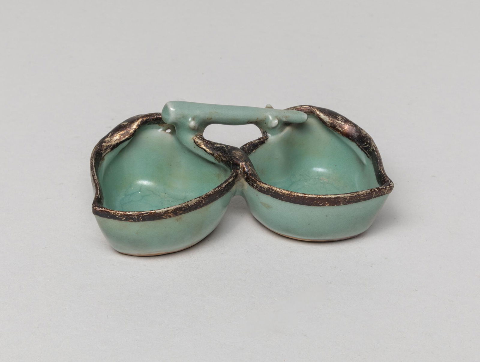 Chinese Ru Stoneware Washer: Modeled as two peach form washers issuing from a straight stem, covered the inside and out in celadon glaze. Approx. 4.5-2.4-1.8 inch.