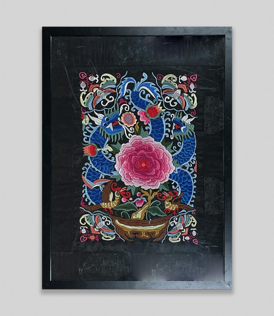 Chinese Embroidery Piece: Framed Chinese embroidery, of flowers, butterflies and beasts on black ground. Approx. 29-21 inch.