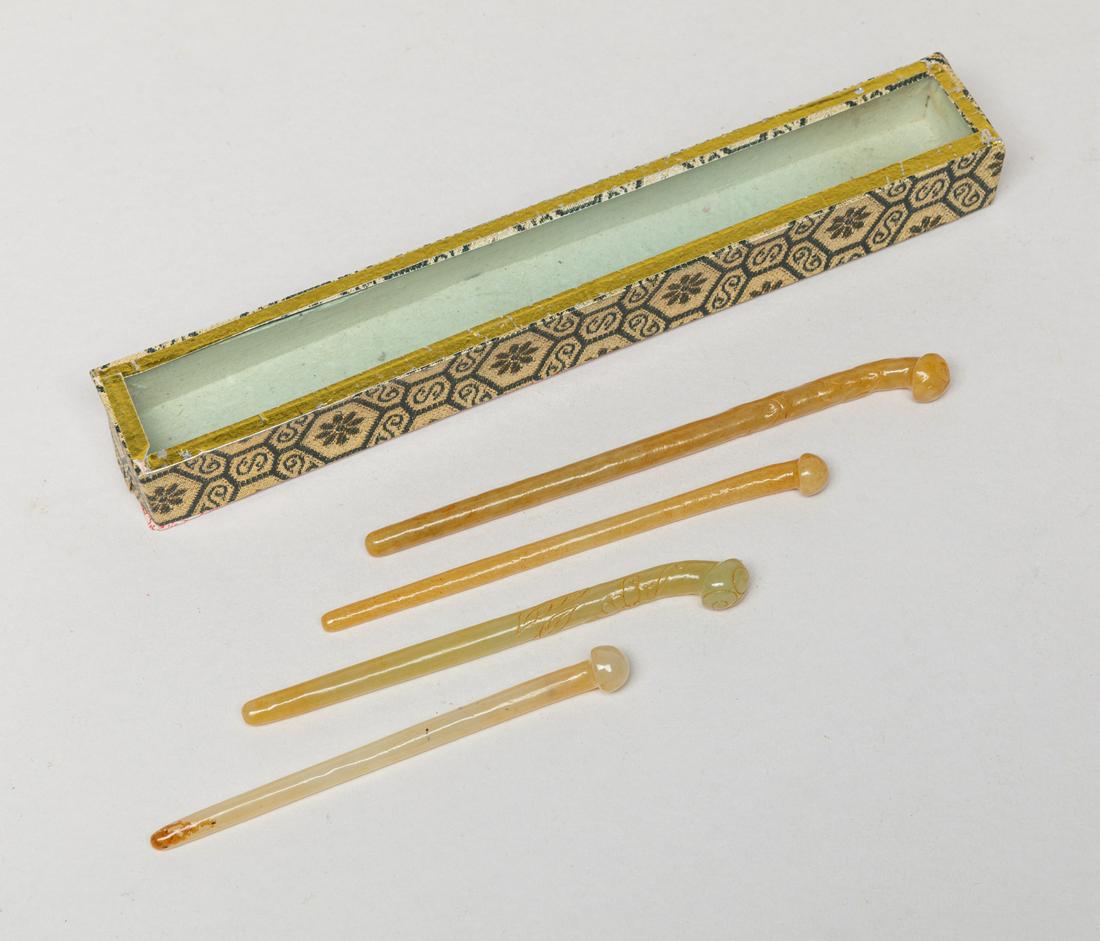 Chinese Yellow Jade Hairpin Sets: Group of four yellow jade carved hairpins, wherein two carved in low relief with leafy peach stems. Approx. 5.4inch L. The Estate of The Pill. Ruan, Taiwan, 1930-2002