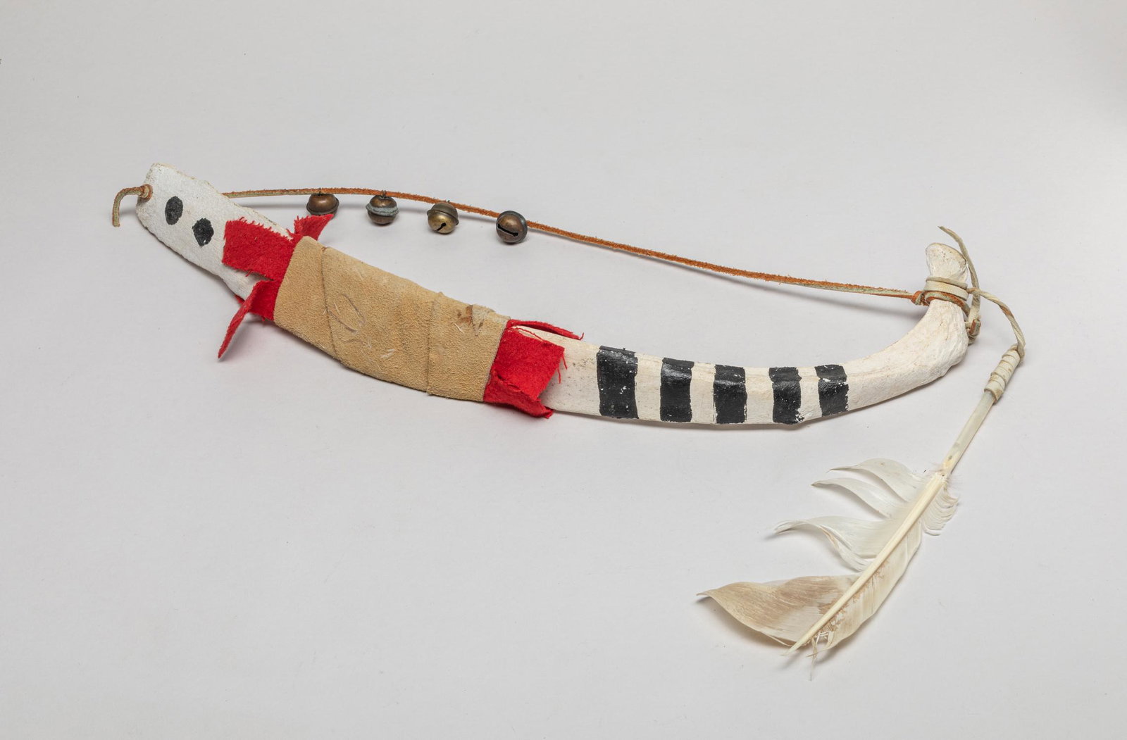 Native American Large Bone Bow: Collectible Native American style bone bow, decorated with feather and four bells. 19.7inch L.
