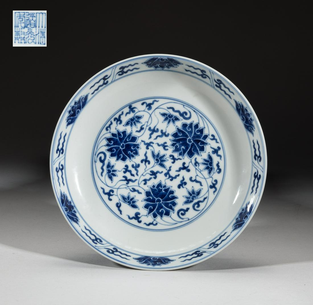 Chinese Export Porcelain Plate: The interior centre and the exterior decorated with undulating lotus sprays, the bottom inscribed with a six-character mark. Approx. 8inch W. The Estate of Josh. H. Doublin. Los Angeles.