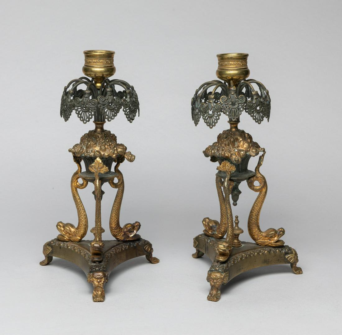 Pair France Gilt Candle-sticks: The French style candlestick holder cast in fountain form supported on three beasts and triangular base. Approx. 9.5-5.2 inch (each).