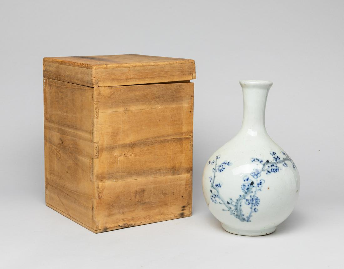 Korean Blue & White Porcelain Vase: The globular body rising to a gently waisted neck, the exterior painted with plum blossom branches, with box. Approx. 8.4-5.3 inch.