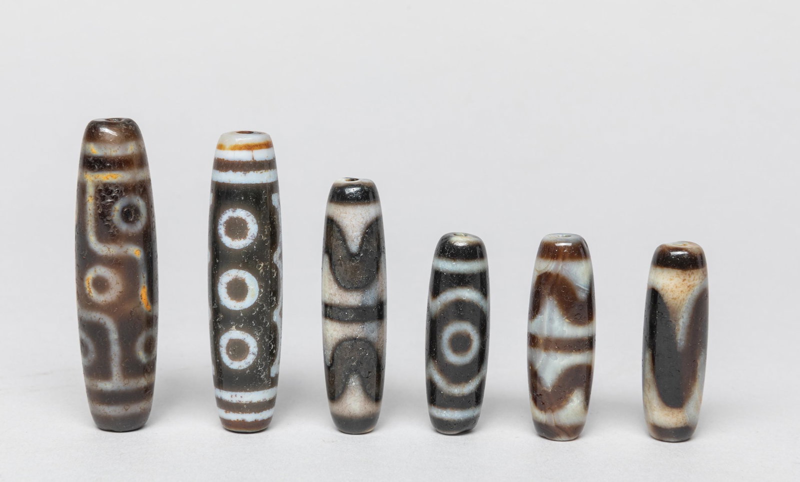 Collectible Chinese Sino-Tibetan Beads: Group of 6 Chinese Sino-Tibetan agate beads. Approx. 2.3inch L (largest).