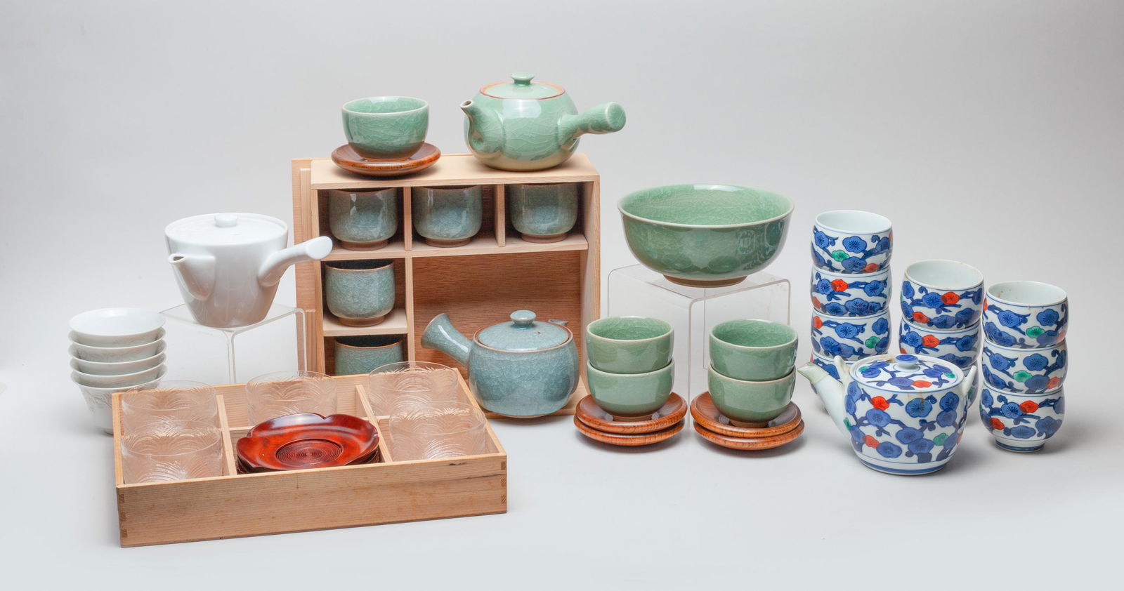 Vintage Japanese Porcelain Tea Sets: Japanese porcelain, wood and glass tea sets. Size varies.