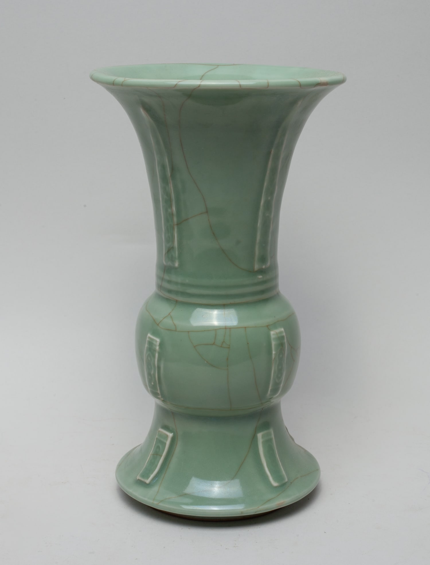 Lg Chinese Longquan Porcelain Vase: Worked in archaic form, covered overall in celadon glaze with brown crackles. Approx. 10-5.7 inch.