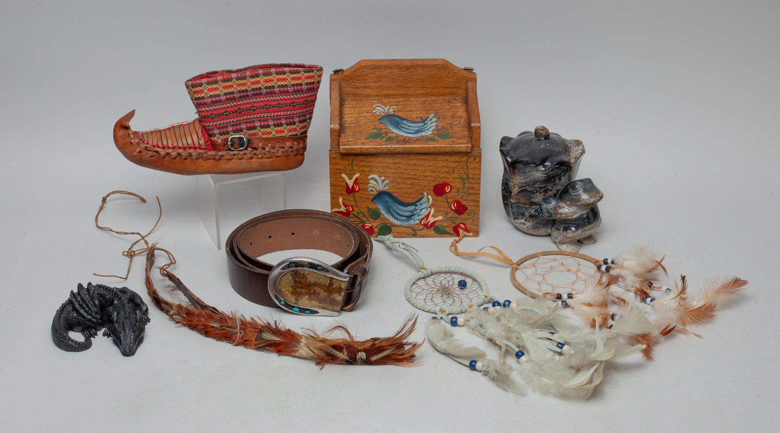 Collectible American Indian Pieces: Including 2 dream catchers, a stone carved sculpture, a feather decor, a shoe, a lizard sculpture and a wood box. Approx. 6-6-3.5 inch (box size).