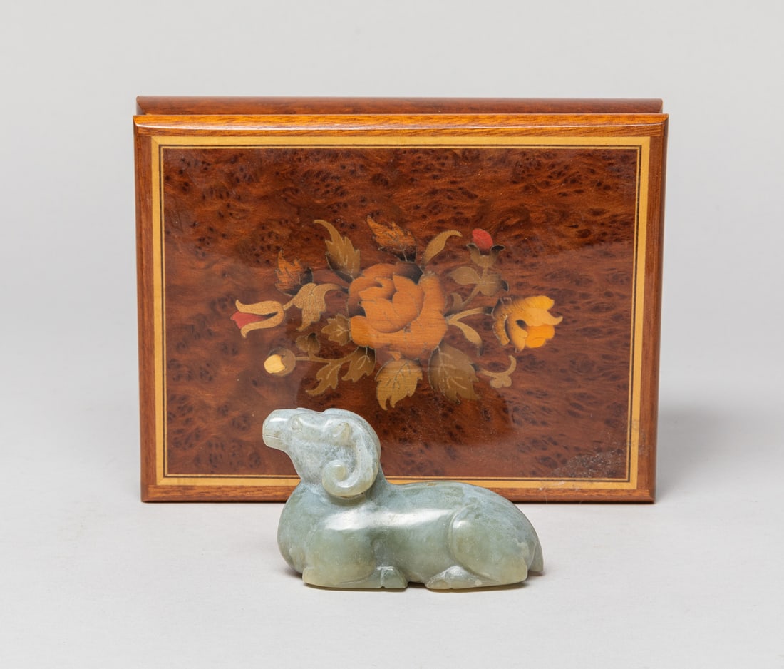 Chinese Chicken-Bone Color Jade Sculpture: Collectible bone-color jade carved sheep sculpture, the four legs tucked beneath its body, its head looking forward, with box. Approx. 3.1-1.2-1.9 inch. The Estate of Julian. H. Push, Los Angeles, 202