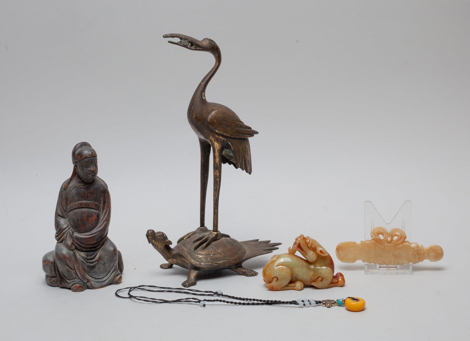 Estate Chinese Metal, Wood & Jade Pieces: Including 2 jade stone carved in beast or scroll form, a necklace, a metal figure sculpture, and a metal sculpture in crane and tortoise form. Approx. 10-6-2.8 inch (largest).