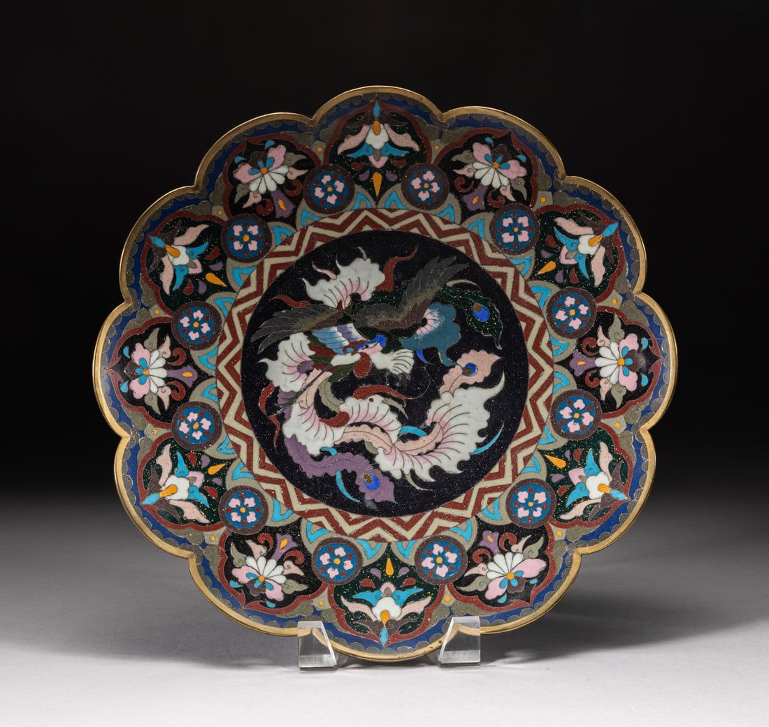 Japanese Meiji Cloisonne Charger: Of flower form, decorated with a sinuous dragon at the centre, surrounded by a band of stylized flowers. Approx. 11.9inch W.