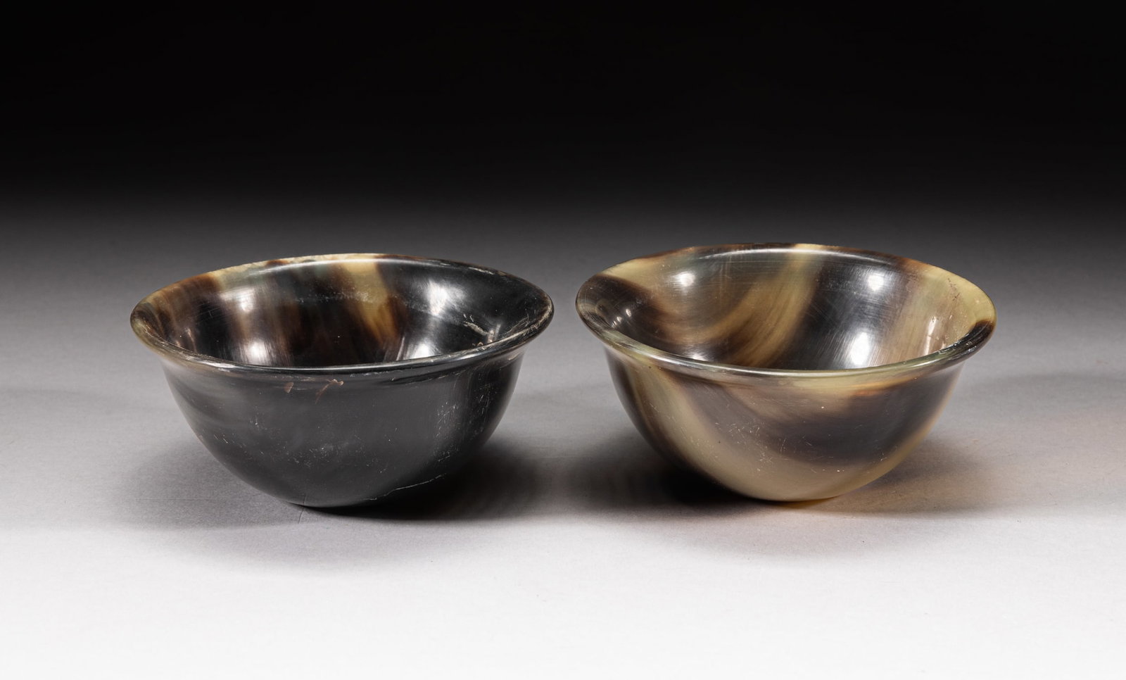 Victorian Carved Black Tea Cups: A pair of carved tea cups, the surface finely smoothed. Approx. 3.5-1.6 inch (each).