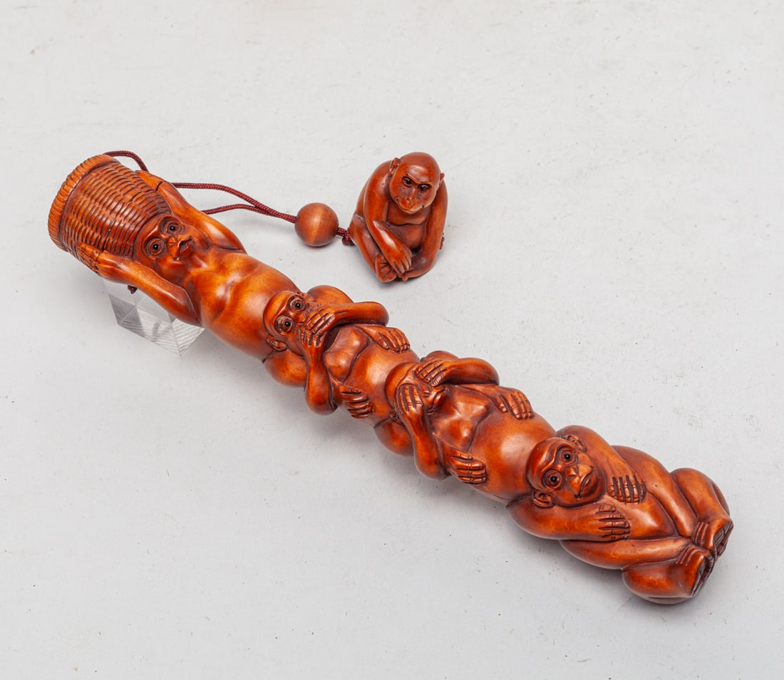 Japanese Boxwood Long Inro: Special form Japanese boxwood inro, carved as four monkeys sitting on each other's shoulder, with a monkey form toggle. Approx. 8.2-1.4-1.3 inch.