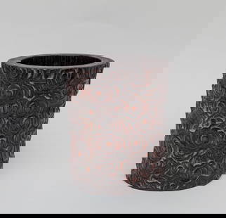 Chinese Bark of Agarwood Brush Pot: Of cylindrical form, the exterior carved with overlapping scrolling clouds. Approx. 5.7-4.7 inch.