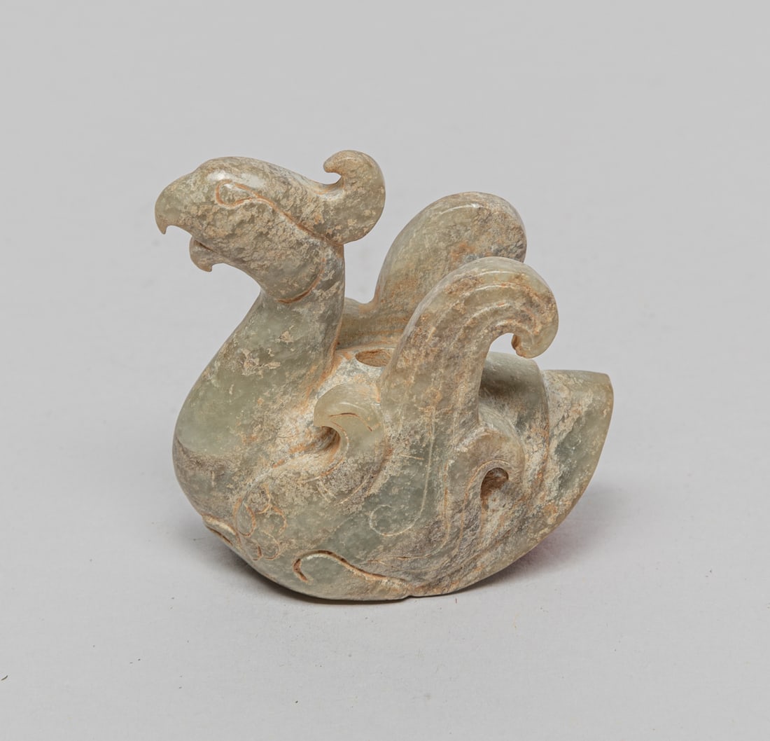 Chinese Jade Carved Bird: Chinese jade carved mythical bird, with tucked legs and raised wings, pierced through the body. approx. 1.8-1.8-0.9 inch.