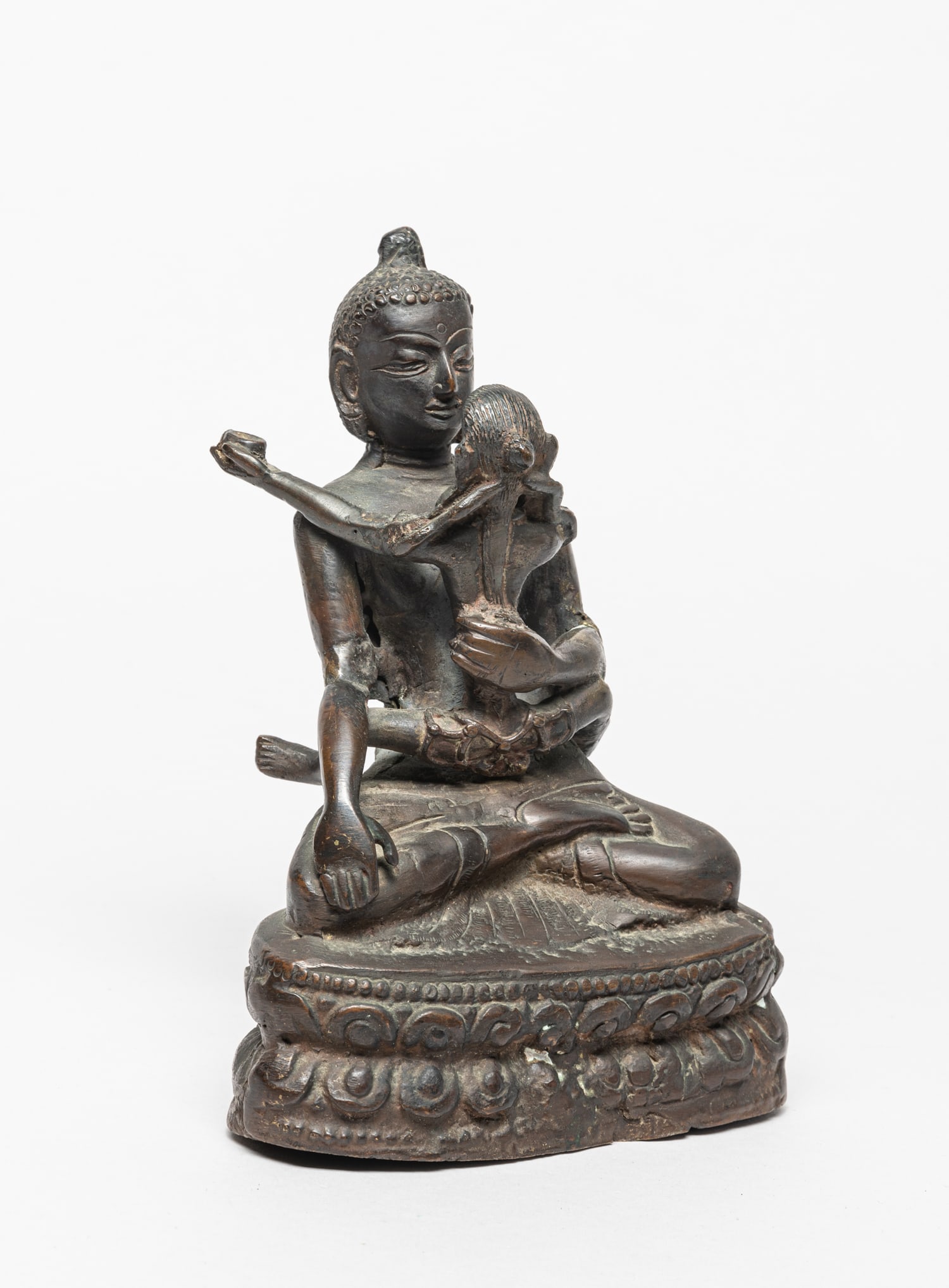 Chinese Bronze Buddha, Sino-Tibetan: Chinese Sino-Tibetan bronze Buddha sculpture, cast seated on double lotus base, holding another Buddha in the chest, both face with serene expression. Approx. 7.3-5.1-2.8 inch.