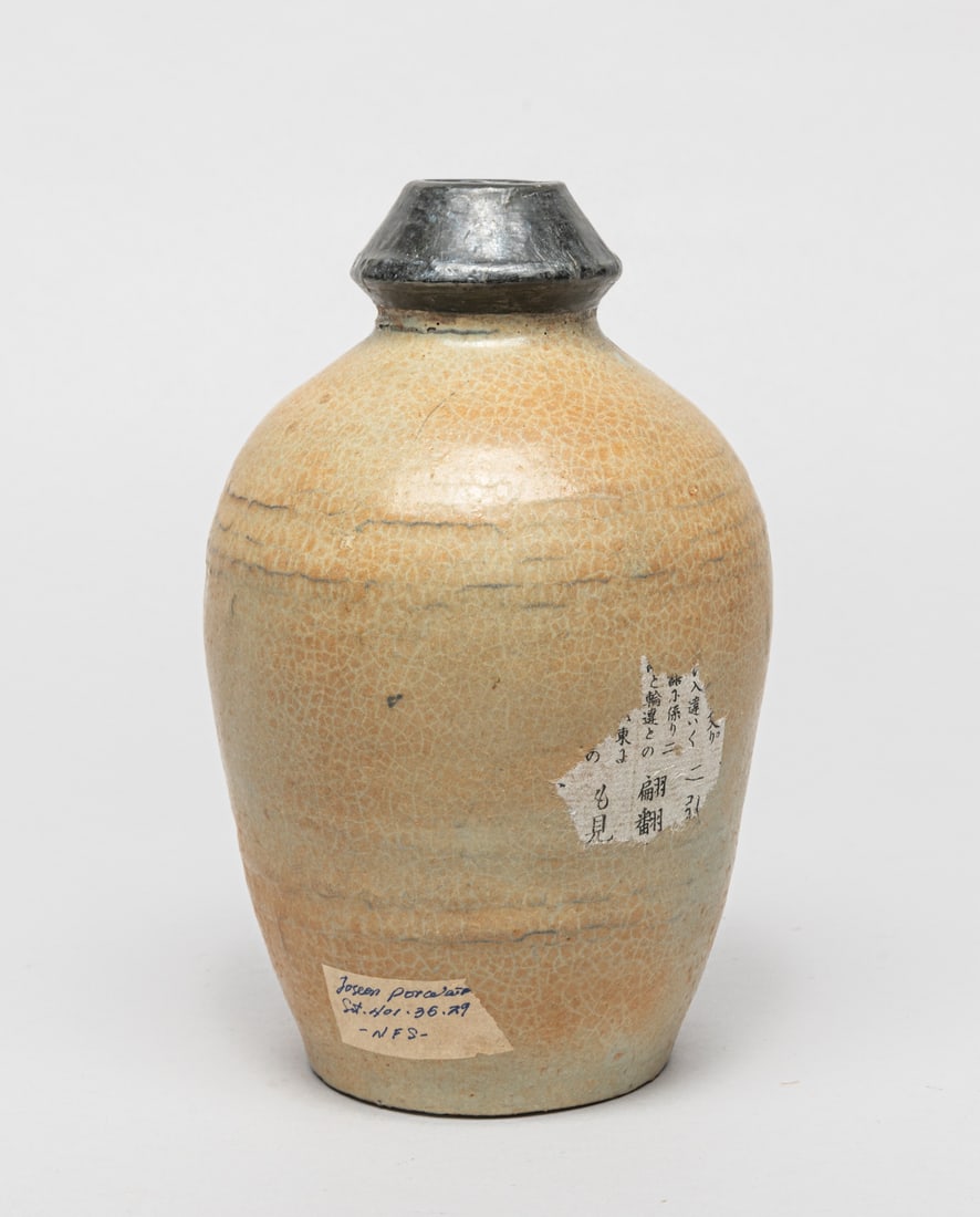 Antique Korean Porcelain Vase: Korean porcelain vase of ovoid form, covered in crackled beige glaze. Approx. 7.3-4.6 inch.
