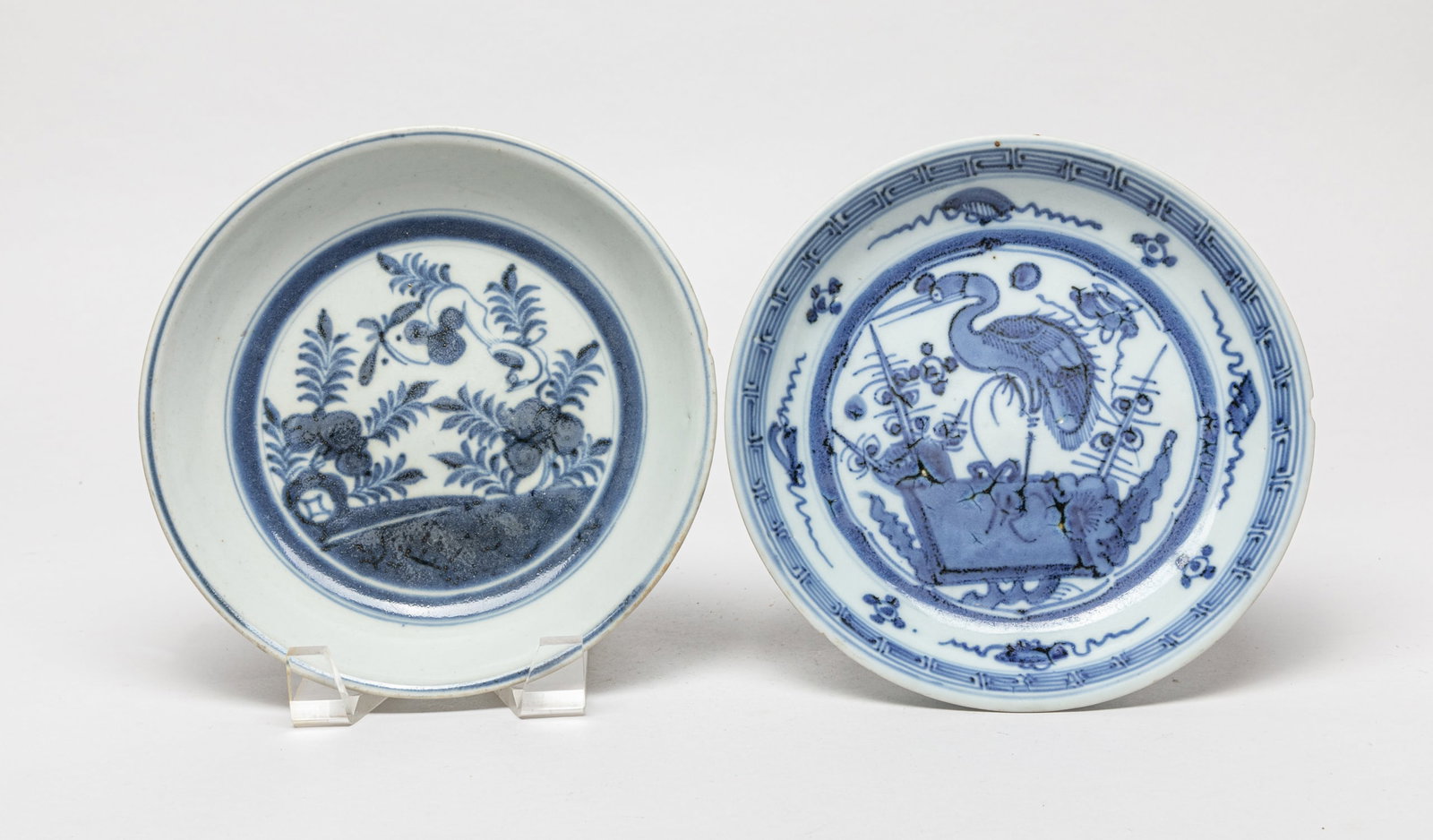 Two Chinese Blue & White Porcelain Plates: Two blue and white porcelain plates, painted with crane or flower, the bottom with two-character mark. Approx. 7.3inch W (larger).