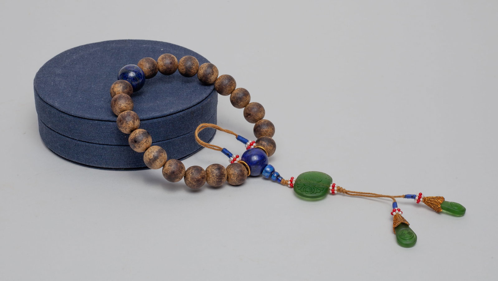 Chinese Export Agarwood Prayer Beads: Chinese agarwood prayer beads with lapis beads and green glass toggles, with box. Approx. 57 gram (total weight including glass and lapis).