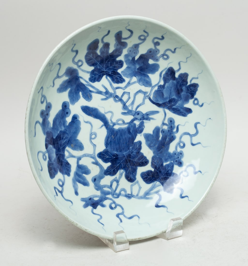 Chinese Blue & White Porcelain Charger: The interior painted with a squirrel among grape vines, the exterior with bamboo. Approx. 10.5inch W.