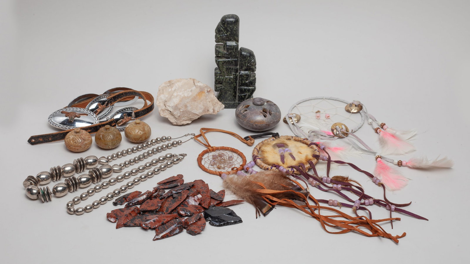 South American Decors: Including stone spear points, dream catchers, stone sculptures, a necklace and a belt. Size varies.