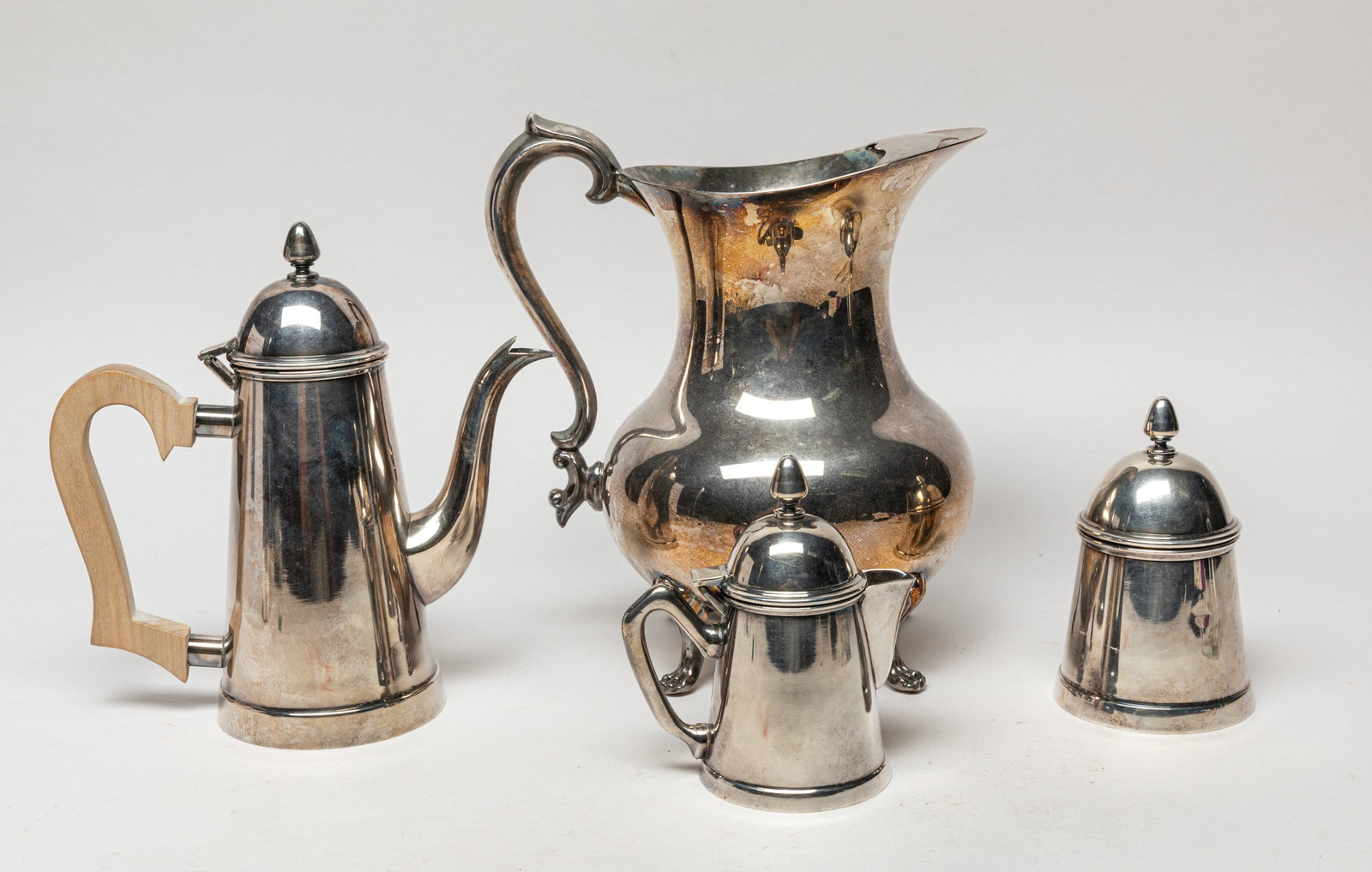 Vintage Silver-Plated Service Pieces: Including a water pitcher, a pot and a sugar bowl and creamer set, the pot, bowl and creamer bottom marked PRATA. Approx. 9-8-6 inch (pitcher size).