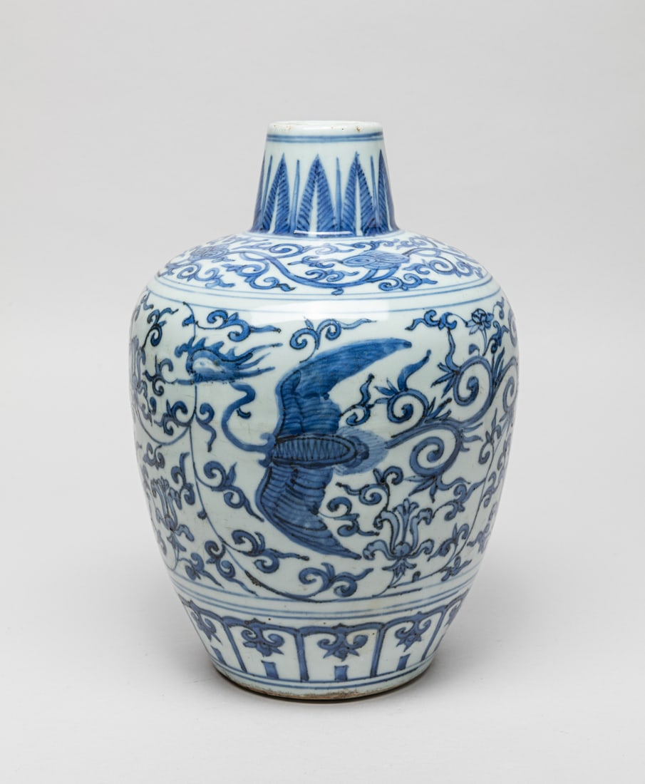 Chinese Export Blue & White Porcelain Vase: The vase exterior painted with phoenix amidst lotus sprays between bands of ruyi and lappets, the bottom with a deer. Approx. Approx. 10.4-7.2 inch.
