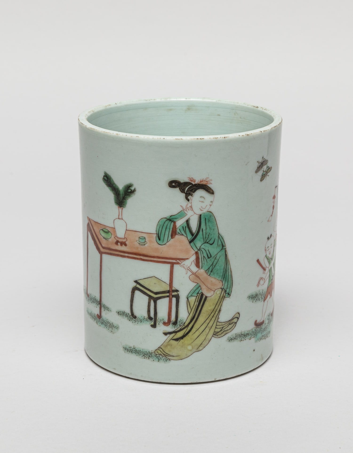 Chinese Wuchai Porcelain Brush Pot: Of cylindrical form, the exterior decorated with a female and two boys in garden setting. Approx. 4.9-4 inch.
