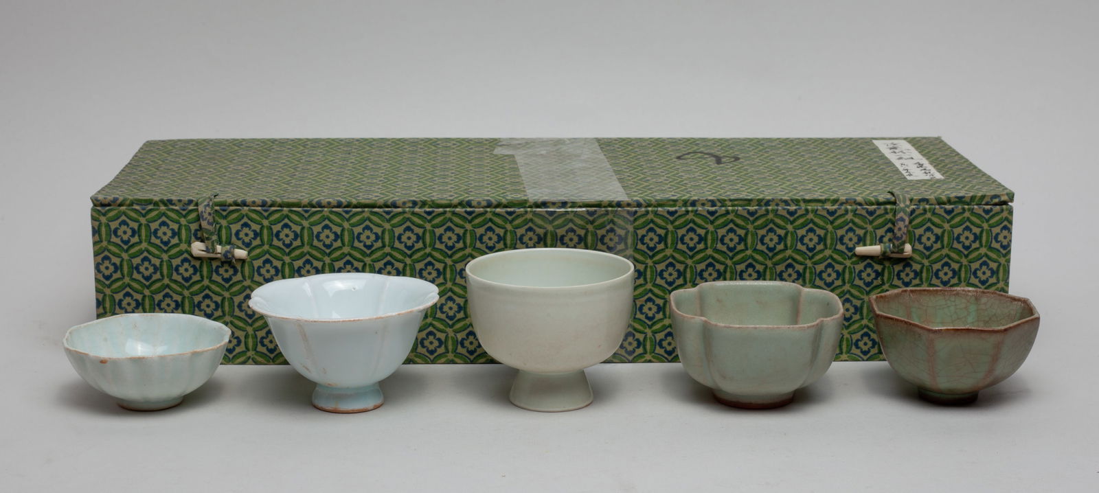 Rare Chinese Porcelain Cups: Group of 5 Chinese porcelain tea cups, covered in pale sea-green or soft celadon glaze, with box. Approx. 3-2.4 inch (largest).