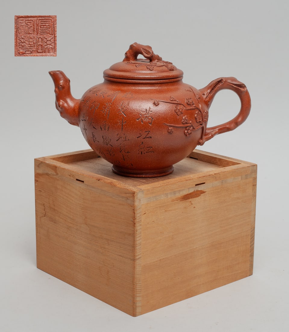 Vintage Chinese Yixing Zisha Tea Pot: Of ovoid form carved with plum blossoms and related poems, the lid interior and the bottom with seal mark, with a lidless box. Appox. 7.7-5-5 inch (w/o box).