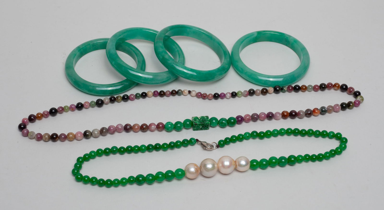 Estate Chinese Color Stone Jewelry Sets: Including 4 color stone bangles and 2 bead necklaces. Approx. 24inch L (larger necklace).