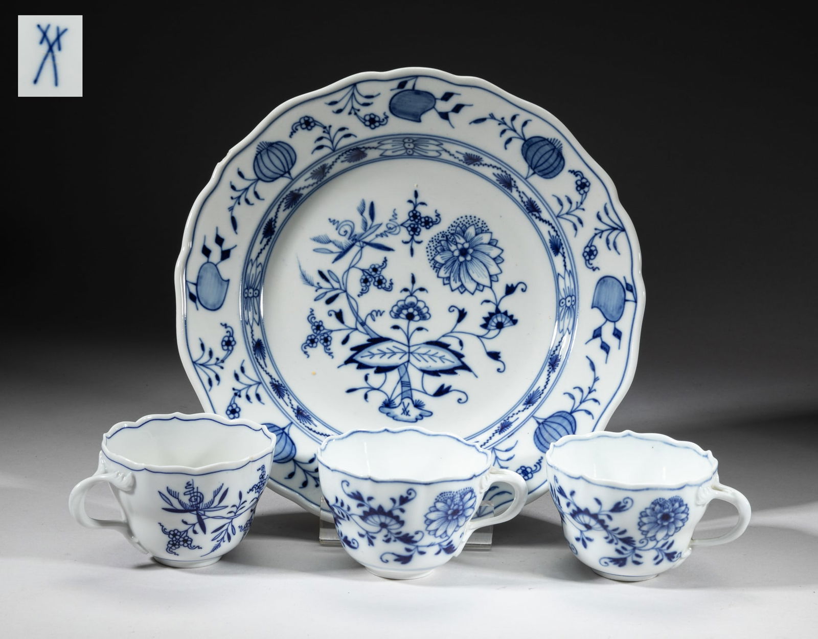 Meissen Porcelain Service Sets: Including a plate and three tea cups, painted with blossoming leafy foliage, the bottom with mark. Approx. 10inch W (plate size).