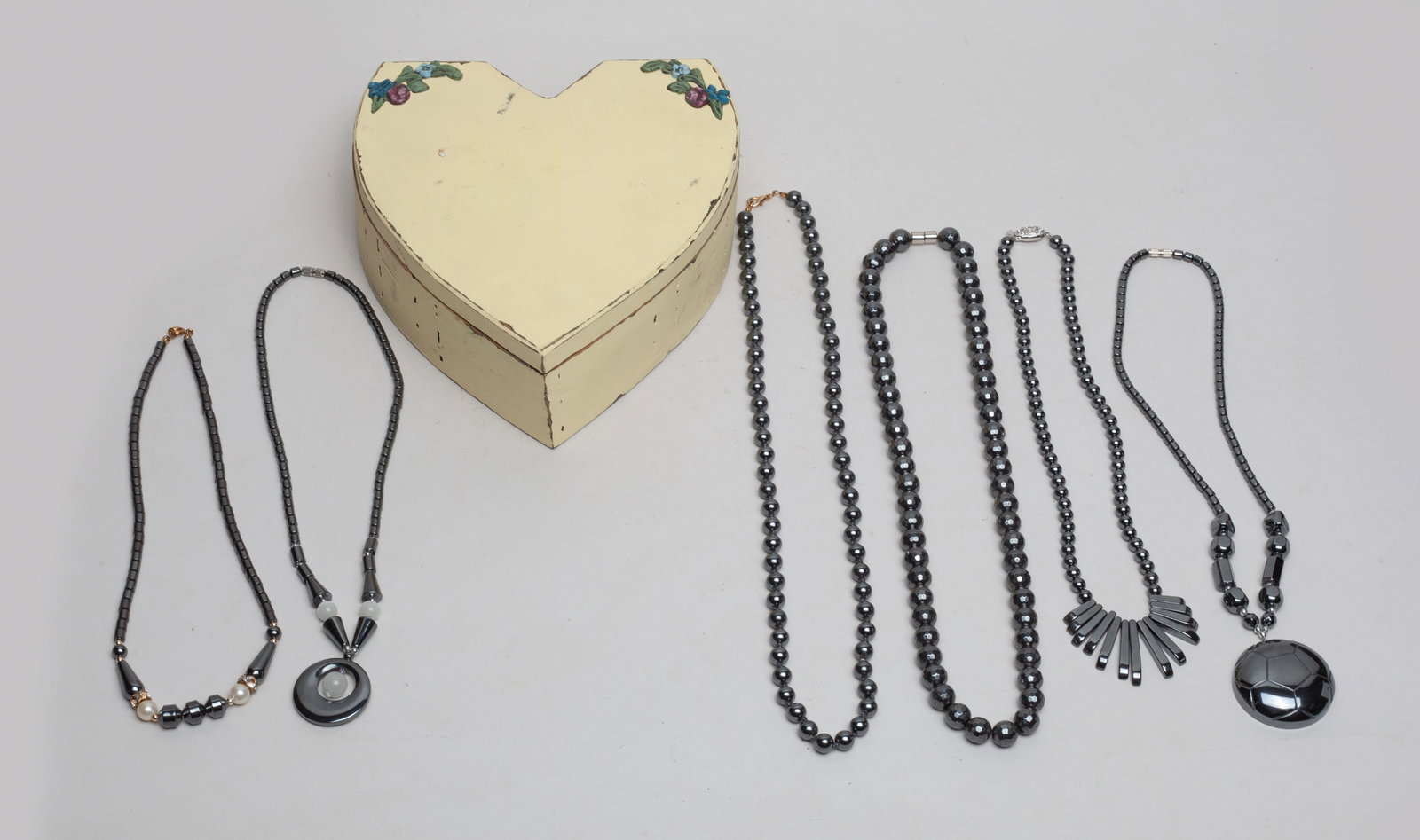 Designed Hematite Necklaces: Group of 6 designed hematite necklaces, with box. Approx. 24inch L (longest).