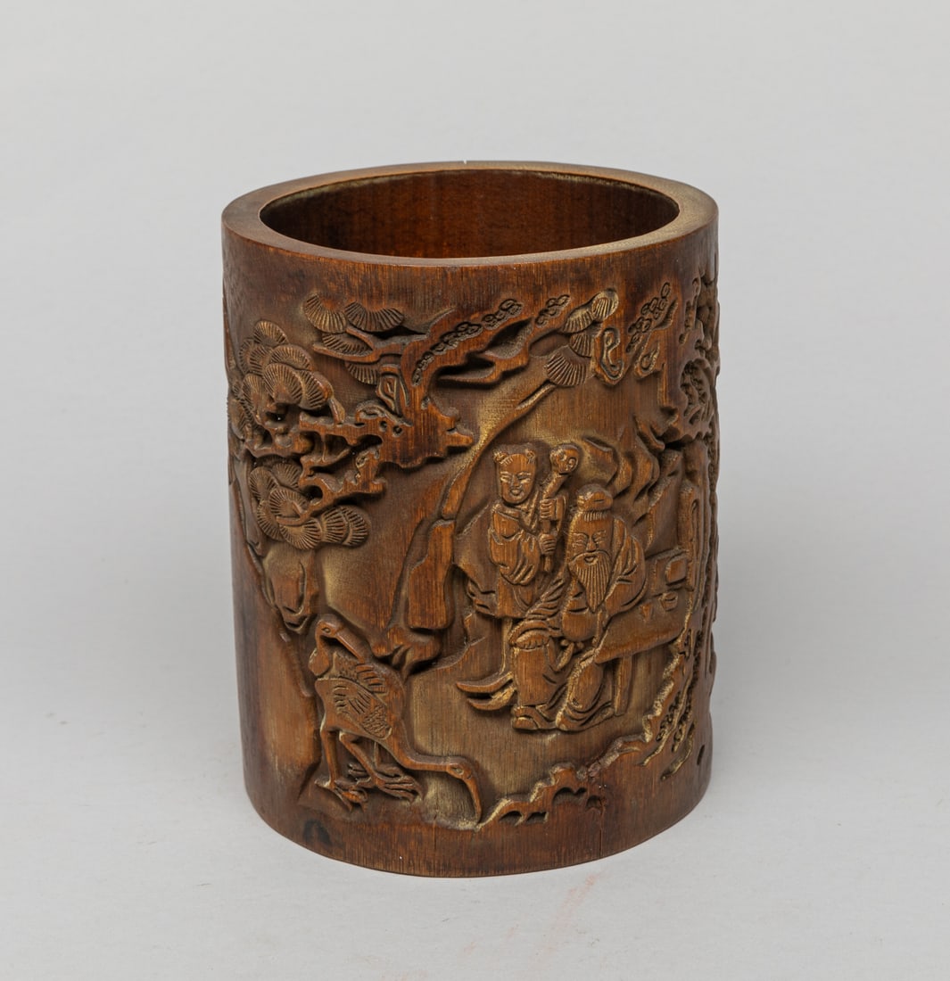 Chinese Bamboo Brush Pot: Of cylindrical form, the exterior carved with figures and cranes in landscape. Approx. 5.6-4.8 inch.