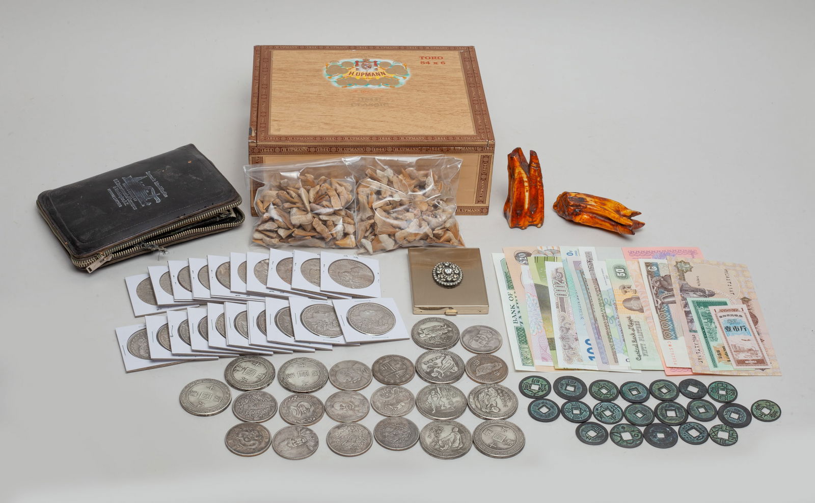 Estate Chinese Fengshui Coins, Fossils: A large group of fossilized animal teeth, Chinese Fengshui coins, American one dollar coins, banknotes and vintage documents, with a box. Size varies.